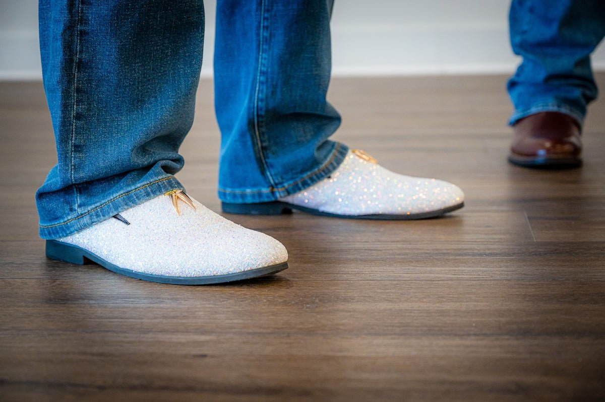 Two people wearing jeans and stylish shoes