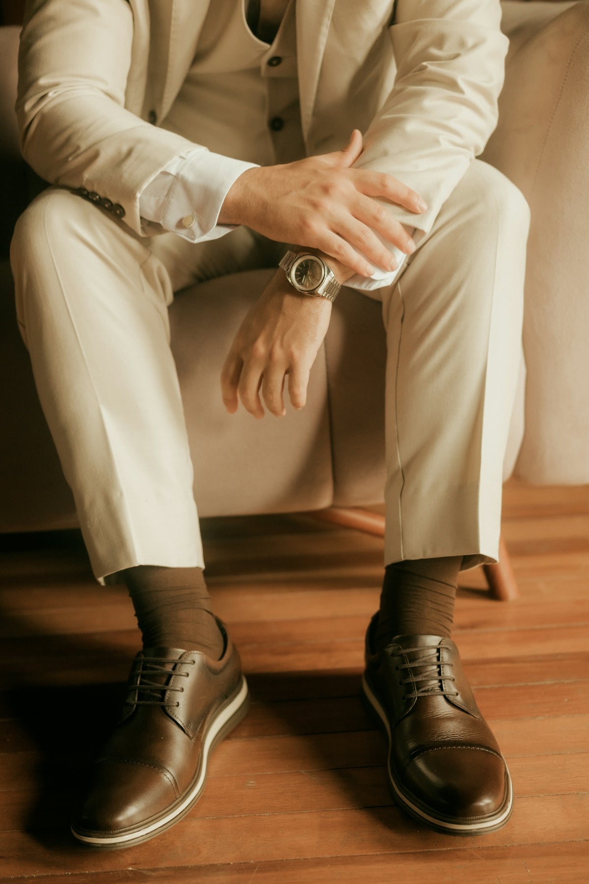 Man in a light suit with brown shoes and socks