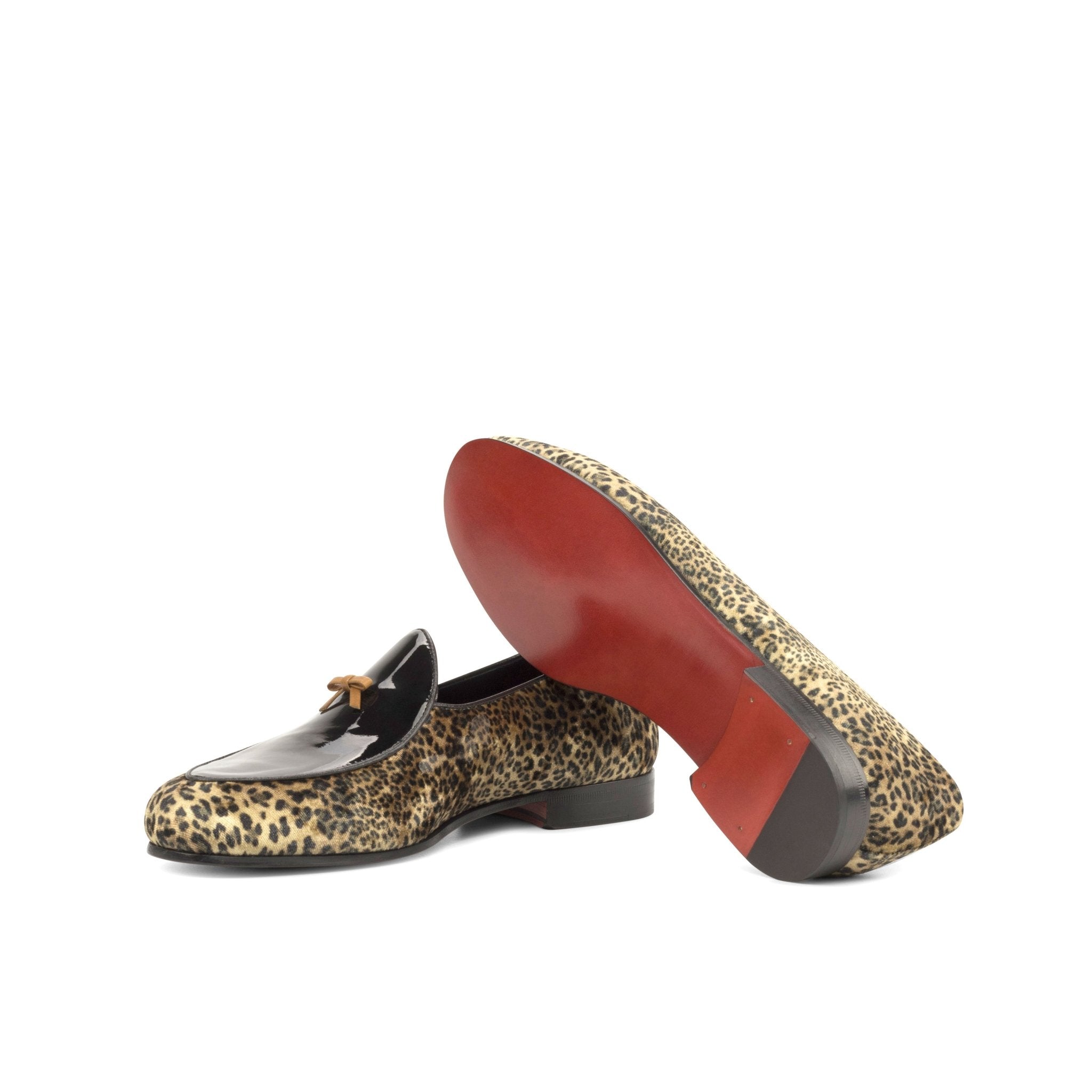 Arconya Leopard print loafers with a red sole on a white background