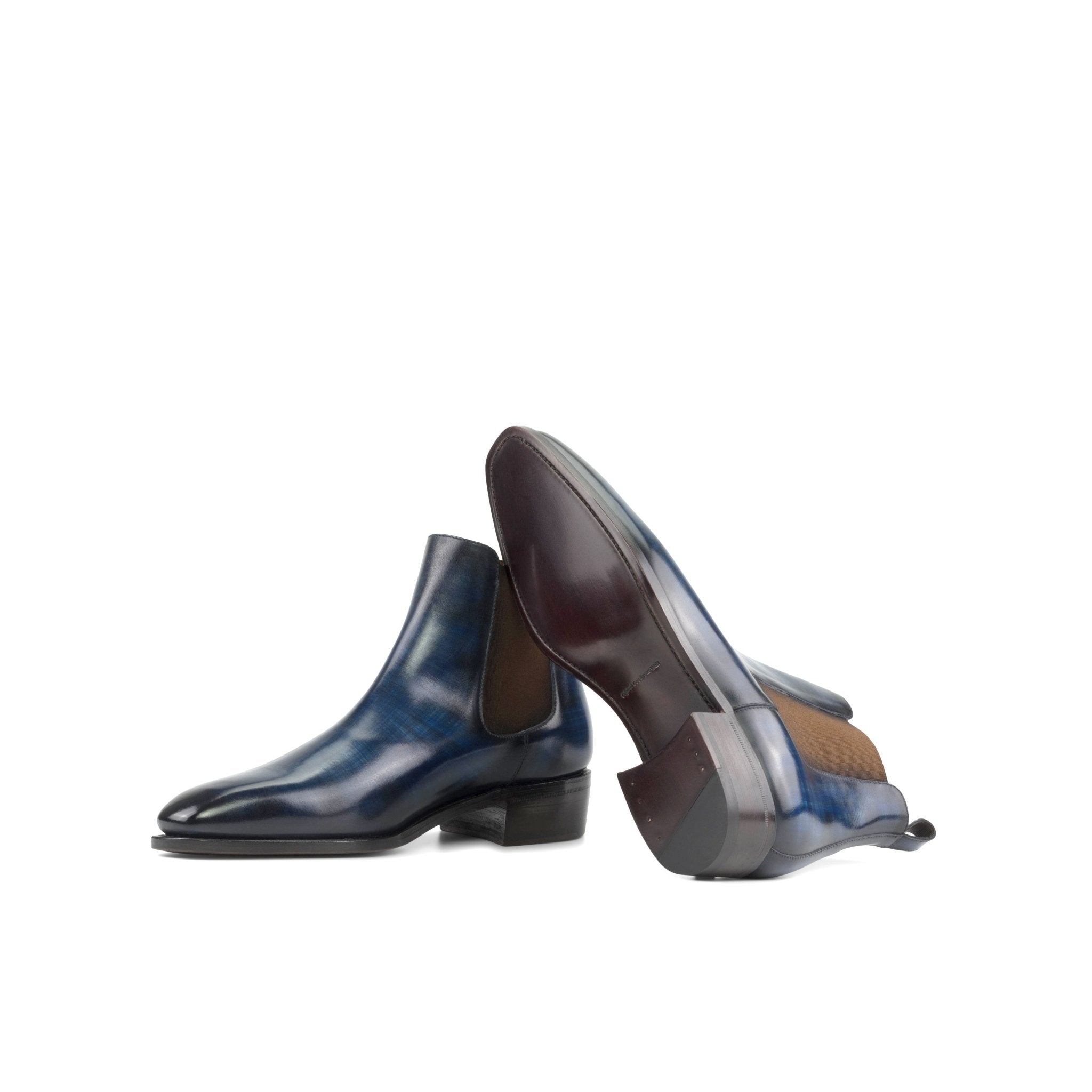 Pair of blue leather shoes on a white background