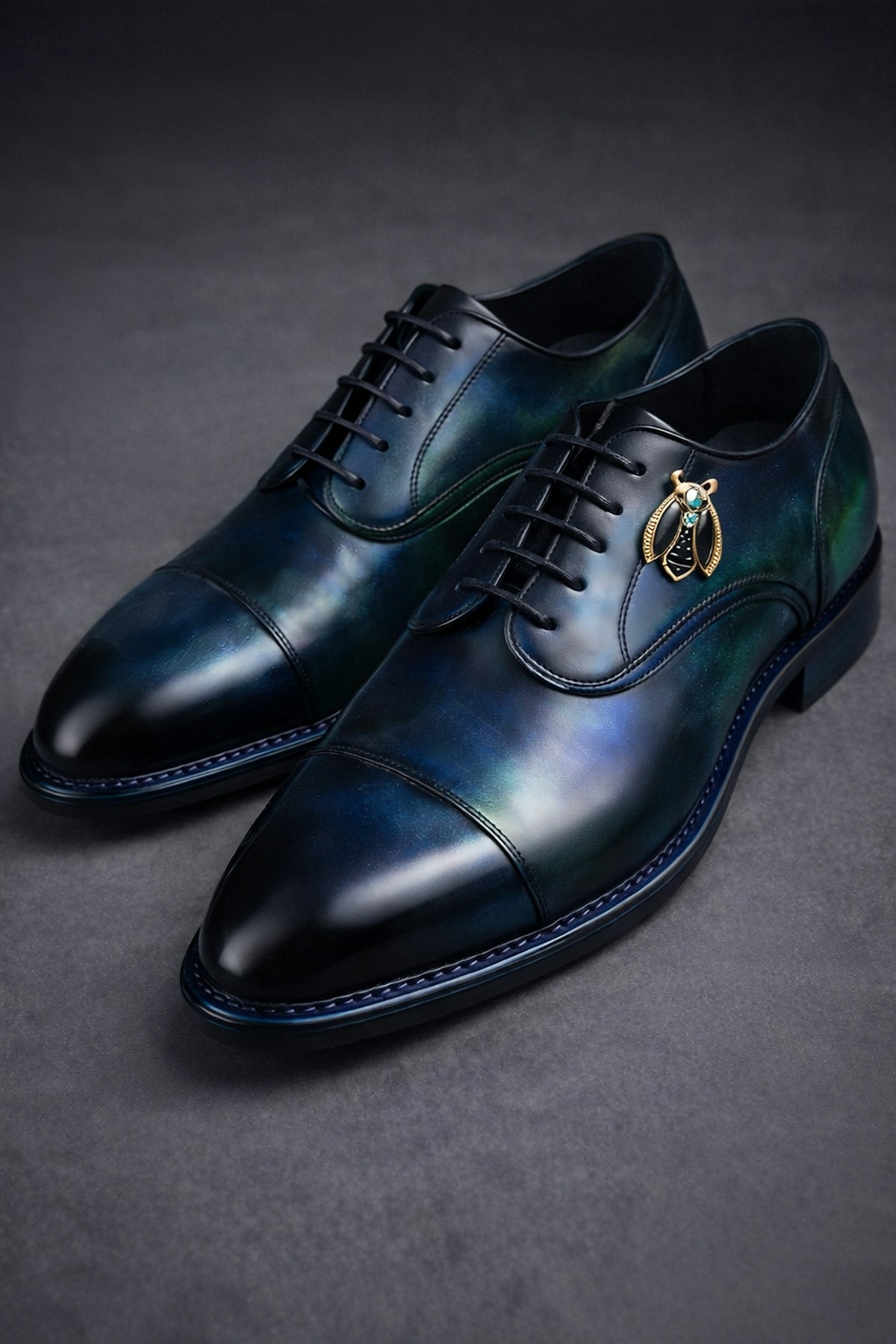 Blue leather dress shoes with bee embellishment