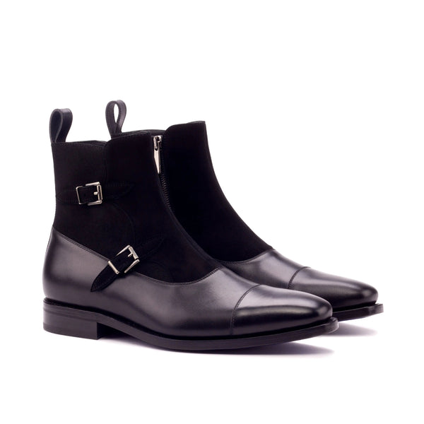 A pair of black men's leather and suede buckle boots with a monk strap and side zipper.