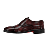 Brown leather shoe displayed on a computer screen with editing tools visible